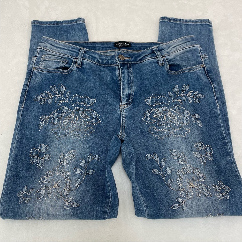 BEBE Blue Straight Leg Jeans with Floral Details. Size 32